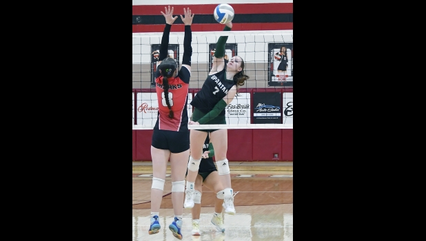 ADRIENNE RAU (#7) goes for a kill against St. Louis last Wednesday.
