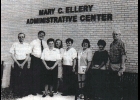 25 Years Ago (June 1999) Executive Secretary, Mary C. Ellery was shocked when she came to work on the morning of June 23rd (1999) and found her name on the administration section of the new addition. Pictured are administration staff members: (from left) Jack White, Charlie Bibbee, Mary Ellery, Kim Browning, June Wilson, Lois Killingbeck, Sue Bishop, and Al Veenkant. Missing from photo is Barb Zapoluch.