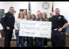 OFFICERS ACCEPT GRANT CHECK: (l-r) Corporal Gregg Nieten (Pinconning Police Department), Tina Bauer (NBCF), Ryan Kowalczyk (NBCF), Mary Idzior (NBCF), Cathy Yaros (NBCF), Andy Kowalczyk (NBCF), Marie Fox (NBCF), Ellen Charlebois (NBCF), Mike Stoner (NBCF), Chief Terry Spencer (PPD). --Courtesy Photo